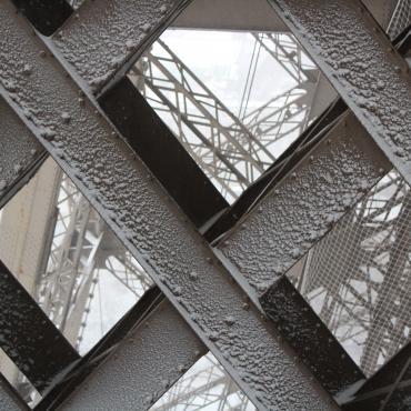 Eiffel Tower structure all white with snow